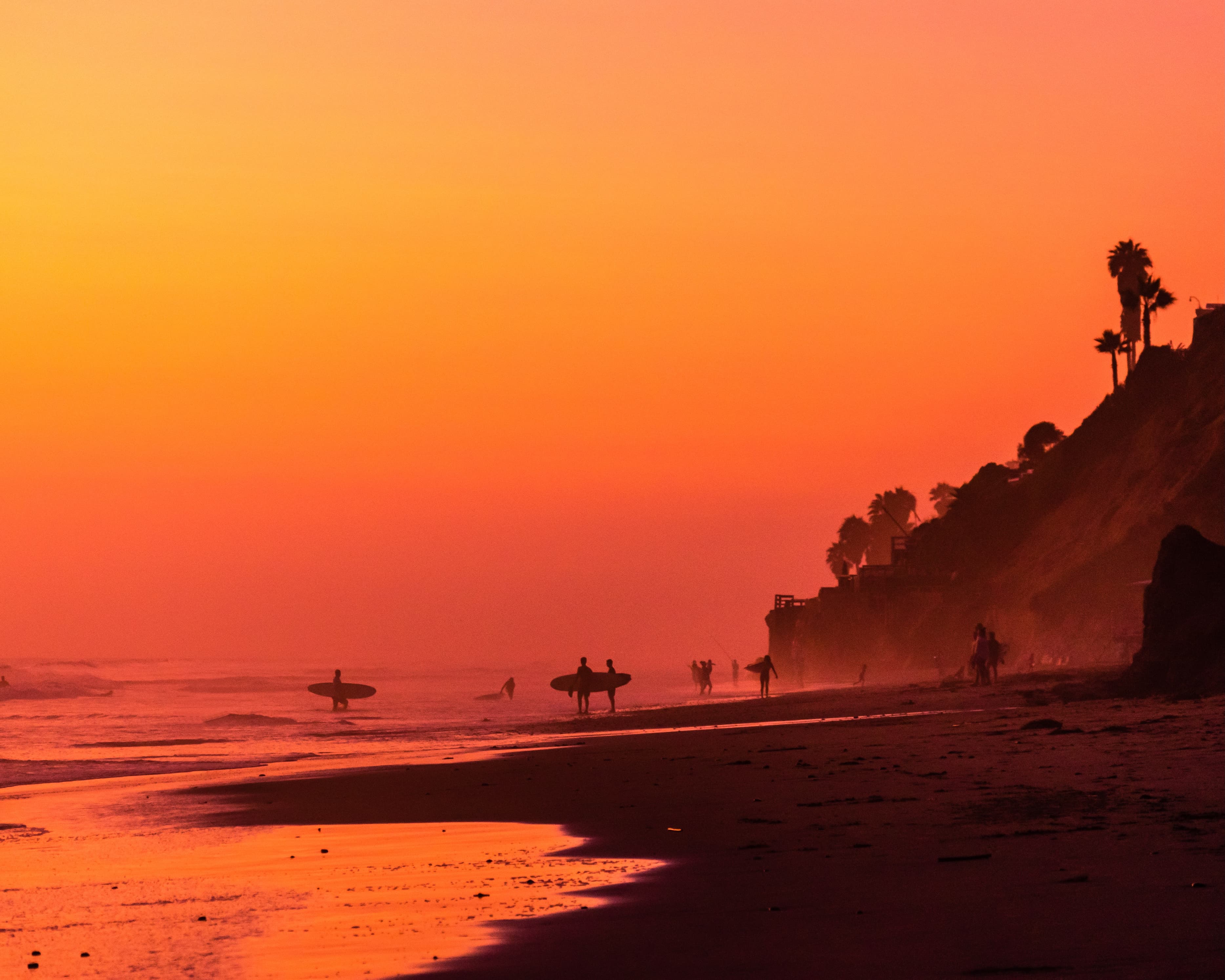 Vibrant coastline with rolling waves and warm sunset light